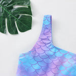 Load image into Gallery viewer, Mermaid scale patterned top on a white background with a green leaf
