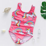 Load image into Gallery viewer, Pink children's swimsuit with unicorn and rainbow patterns on a white background.
