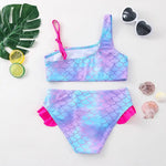 Load image into Gallery viewer, Mermaid scale patterned two-piece swimsuit with pink accents on a white background.
