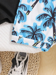Close-up of a swimsuit with palm tree pattern on a white background