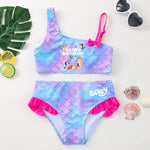 Load image into Gallery viewer, Mermaid-themed children's swimsuit with 'Happy Birthday' and 'Bluey' text, surrounded by decorative items on a white background.

