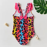 Load image into Gallery viewer, Colorful leopard print swimsuit with ruffled straps on a light background
