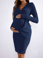 Load image into Gallery viewer, Woman wearing a navy blue knit dress against a white background
