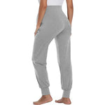 Load image into Gallery viewer, Gray sweatpants worn by a person on a white background
